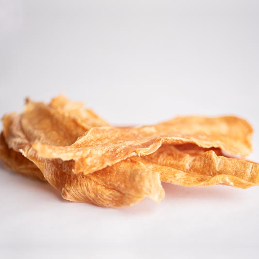 All of our chicken jerky treats are handmade with only the finest ingredients. We start with lean, organic chicken breast, then, we slow dry the chicken until it is perfectly tender. Our Big Bites are just a little thicker then regular chicken jerky.